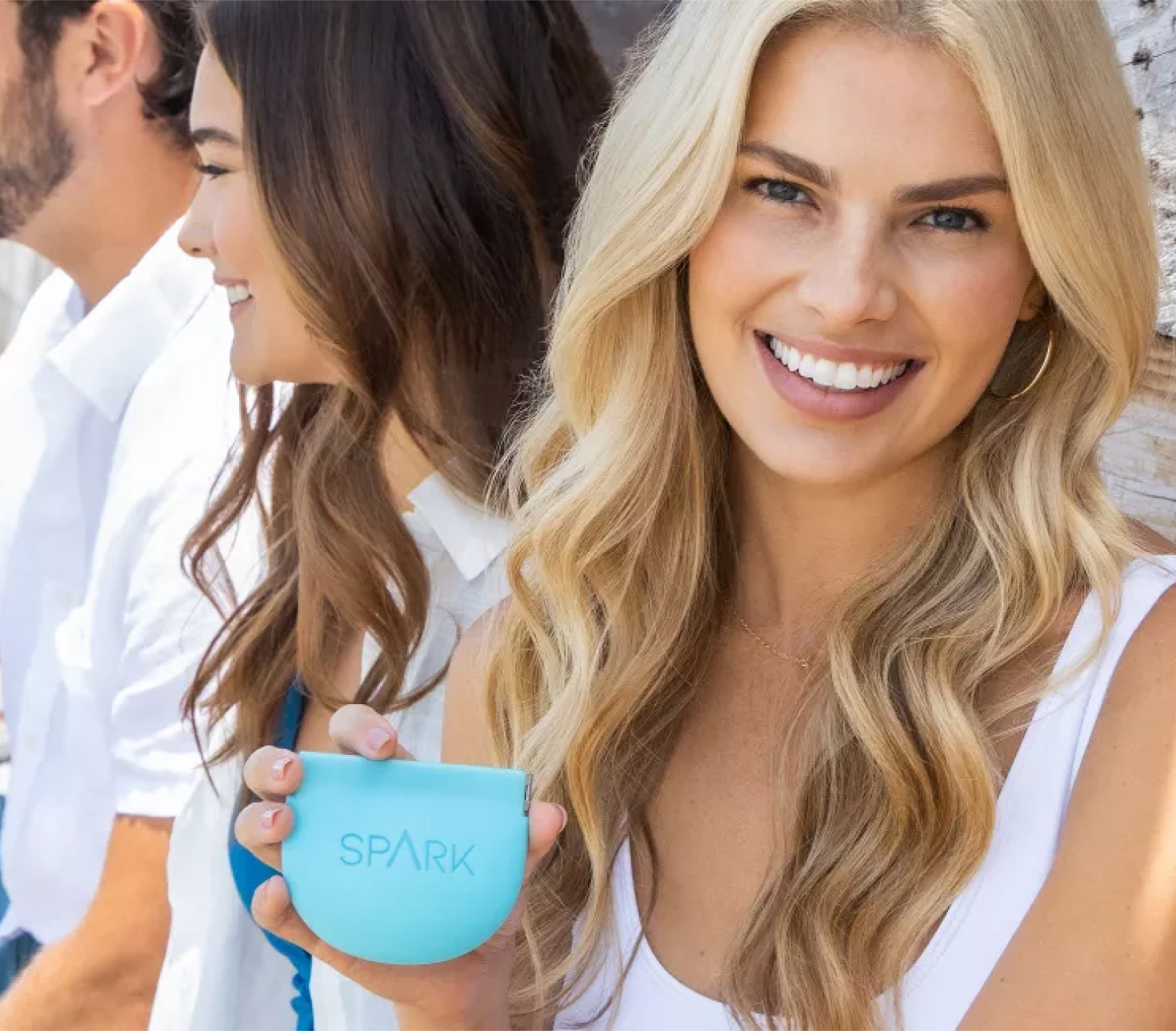 Woman wearing Spark clear aligners for teeth straightening during orthodontic treatment.