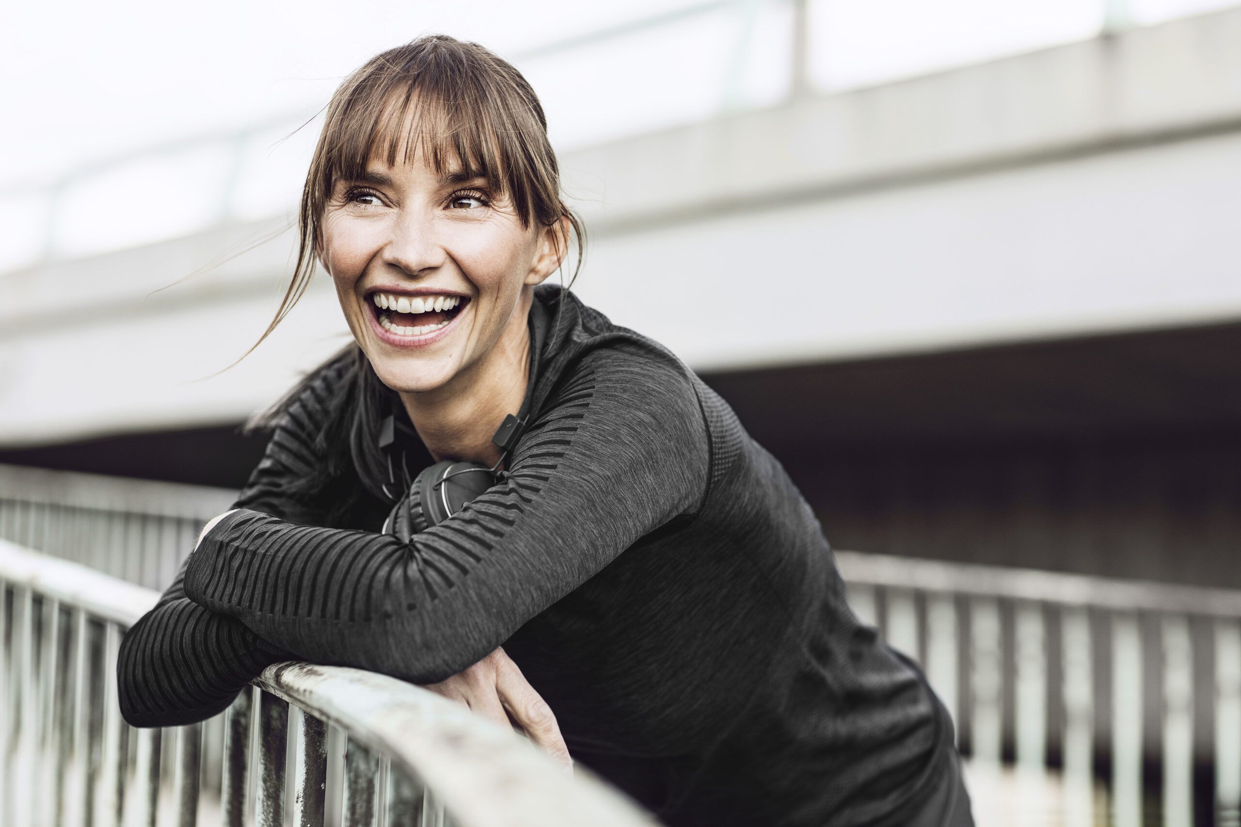 Smiling woman with ClearCorrect aligners
