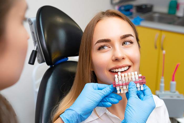 Cosmetic dentist Adelaide dental bonding and cosmetic dentistry for a brighter smile Adelaide cosmetic dentist shade-matching teeth for cosmetic dental bonding to enhance a smile and support oral health