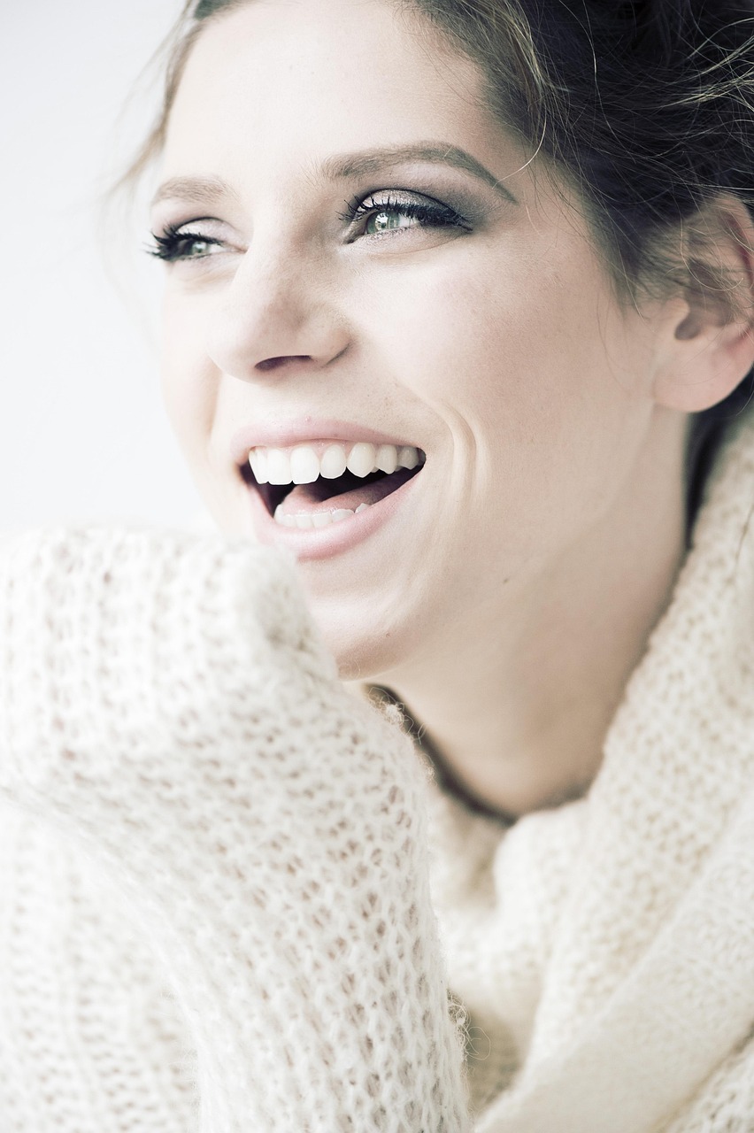 Invisalign Adelaide | Invisalign Clear Aligners for Teeth Straightening Woman smiling with straight teeth, illustrating Invisalign Adelaide and cosmetic dentistry